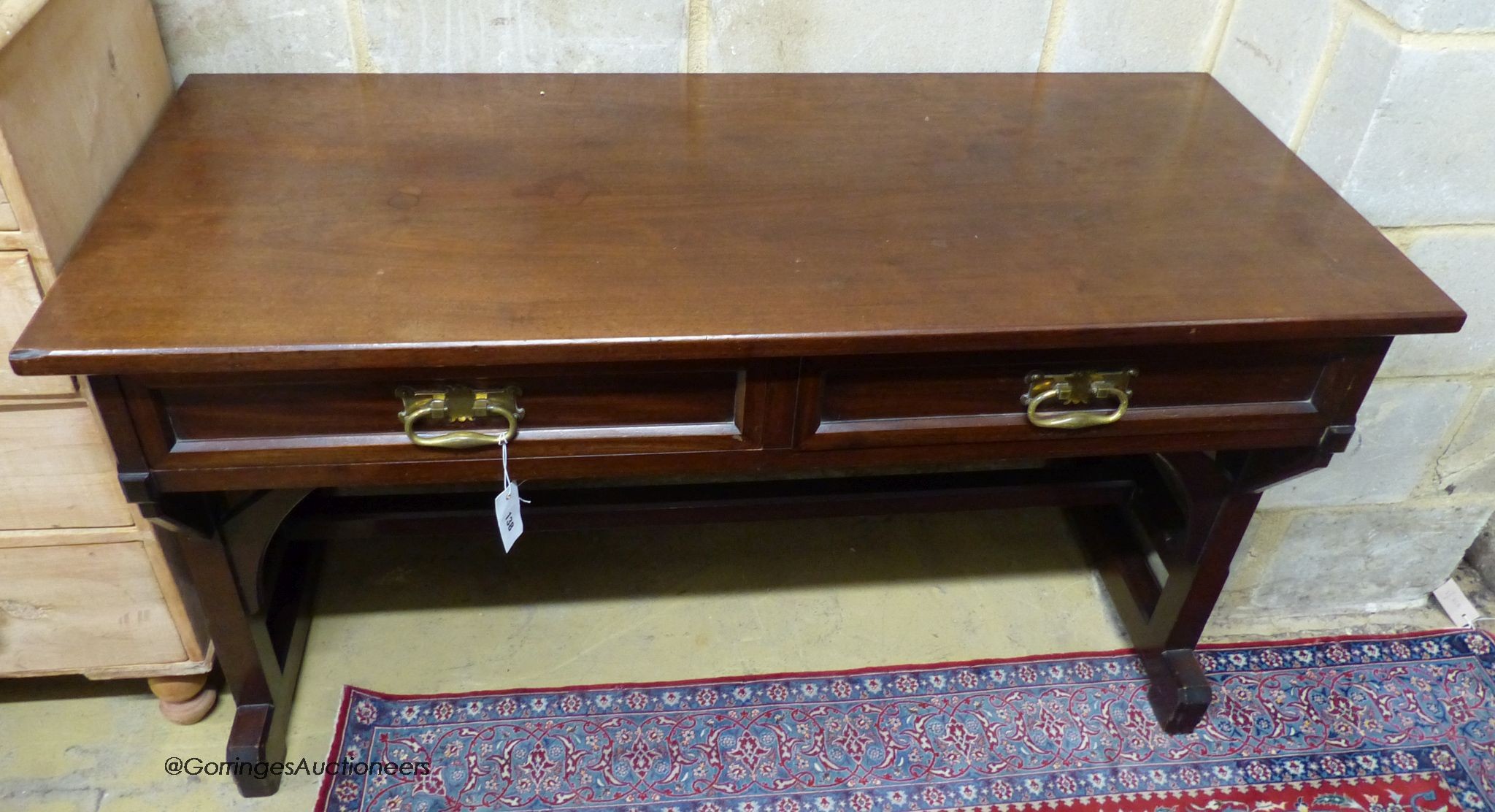 A Victorian Pugin style mahogany two drawer side table, width 130cm, depth 56cm, height 74cm